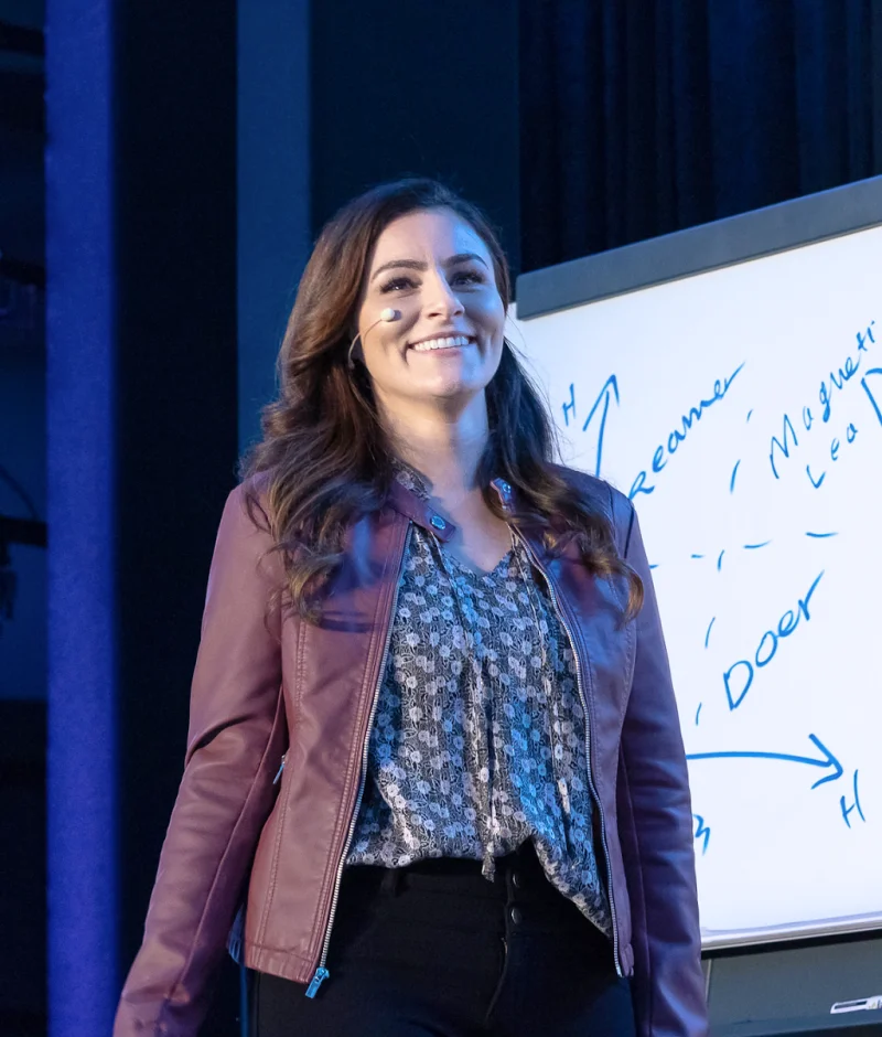 Jen Casey teaching beside a whiteboard